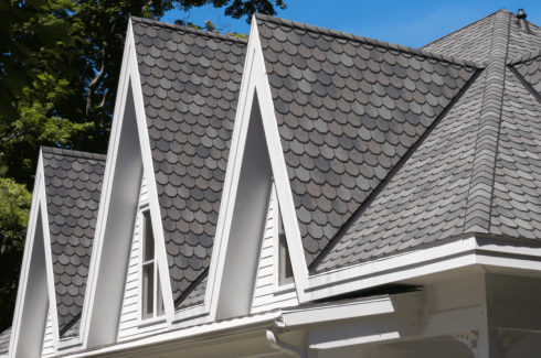 Home with newly installed gutters by GRT Roofing