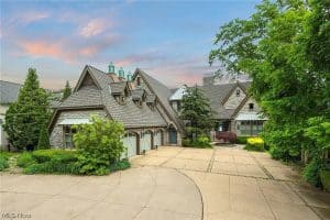 A well-kept home ready for GRT Roofing services, with healthy trees around.