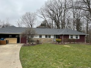 A home that may need gutter screens or storm drain help to prevent water damage.
