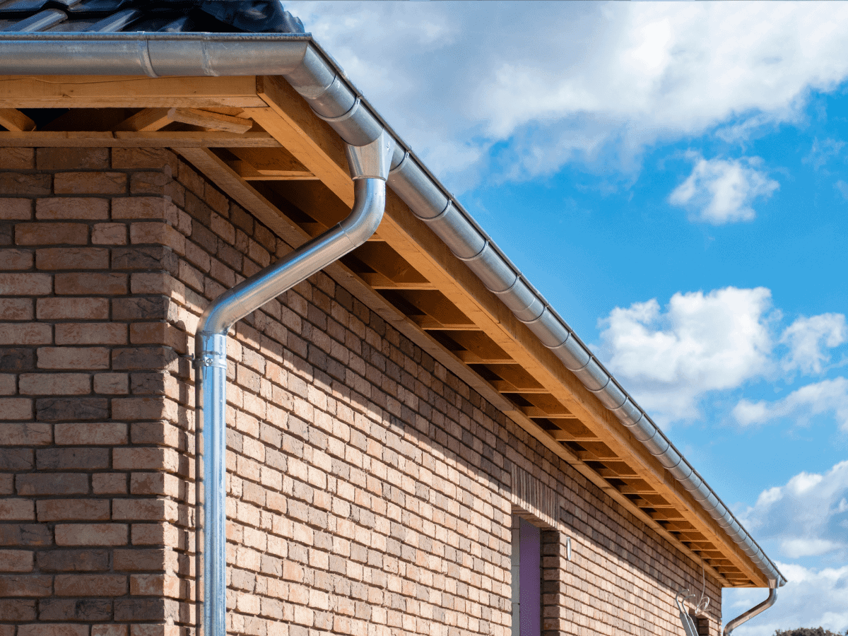 Seamless gutter installation on a residential home